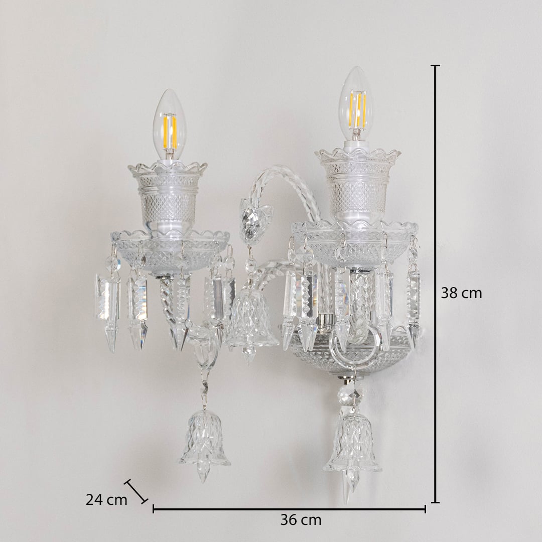 Double arm crystal wall light with ornate glass shades and crystal accents size 24cm height 38cm width 36cm depth displayed with measurements.