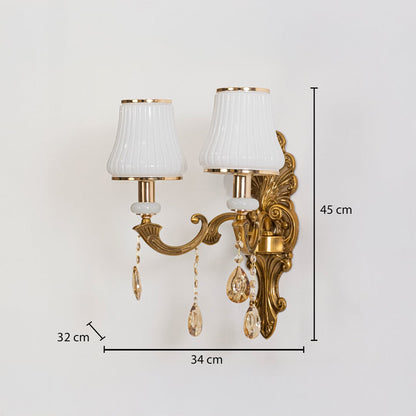 Two light crystal sconce with ornate gold base and crystal drops size 45cm height 34cm width 32cm depth.