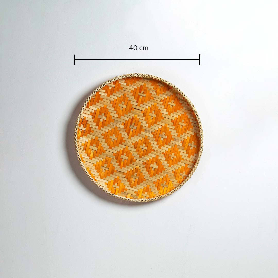 Dimension image of handcrafted orange and natural seagrass wall basket for boho living room wall décor display.