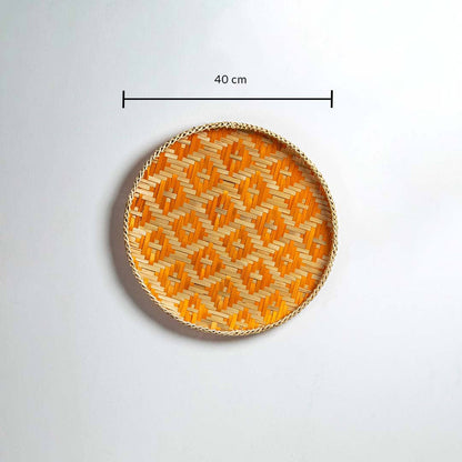 Dimension image of handcrafted orange and natural seagrass wall basket for boho living room wall décor display.