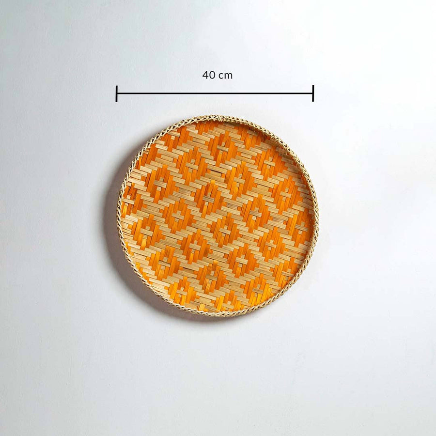 Dimension image of handcrafted orange and natural seagrass wall basket for boho living room wall décor display.