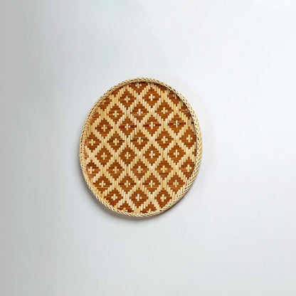 Natural woven brown and beige seagrass wall basket for living room boho décor on white background image.
