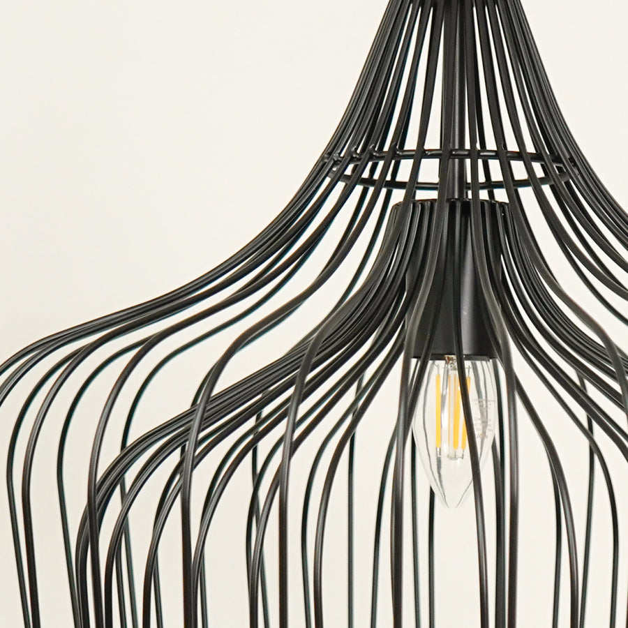 Closeup of black metal cage pendant light showcasing artistic curves and premium details.