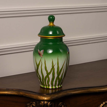 Elegant green and white ceramic jar with golden rim and butterfly artwork perfect for modern home interiors.