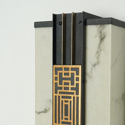 Close view of outdoor wall light with geometric gold detailing and glass panel showcasing premium modern exterior lighting design.