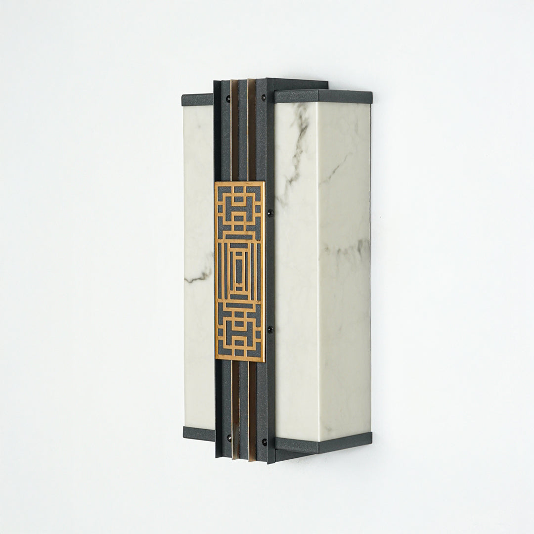 Minimal outdoor wall lantern with geometric pattern and glass enclosure perfect for modern patio or entryway lighting.

