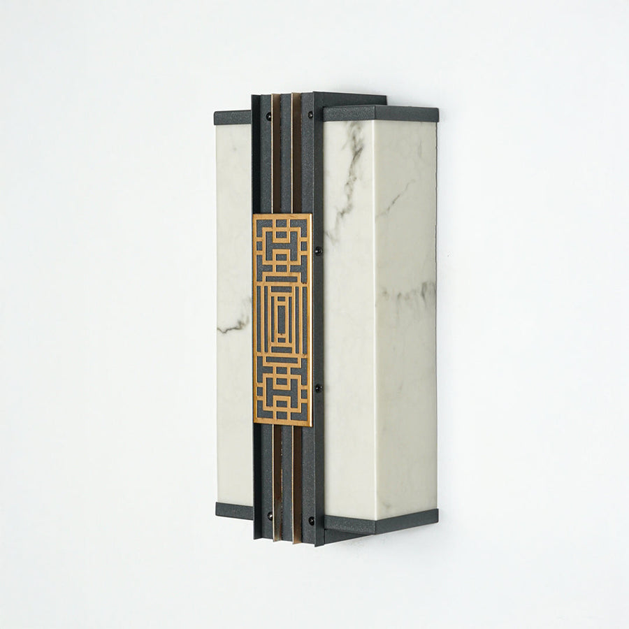 Minimal outdoor wall lantern with geometric pattern and glass enclosure perfect for modern patio or entryway lighting.

