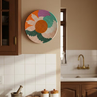 Multicolor decorative wall plate displayed in a dining space for artistic contemporary wall decor and home interiors.