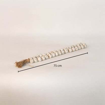 Speckled bead garland measuring 75 cm long ideal for tabletop console or shelf styling in modern interiors.