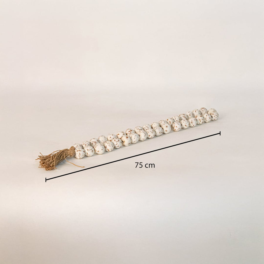 Speckled bead garland measuring 75 cm long ideal for tabletop console or shelf styling in modern interiors.