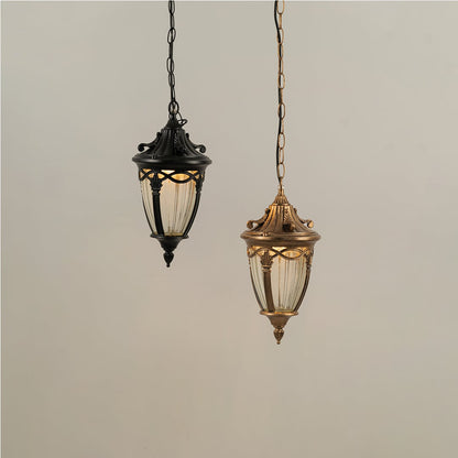 Grouped display of antique gold metal lanterns with lights off showcasing elegant outdoor lighting design.