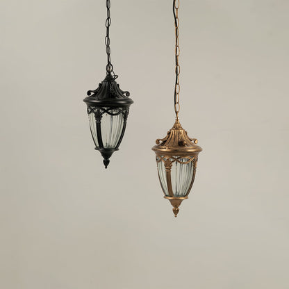Grouped display of antique gold metal lanterns with lights off showcasing elegant outdoor lighting design.