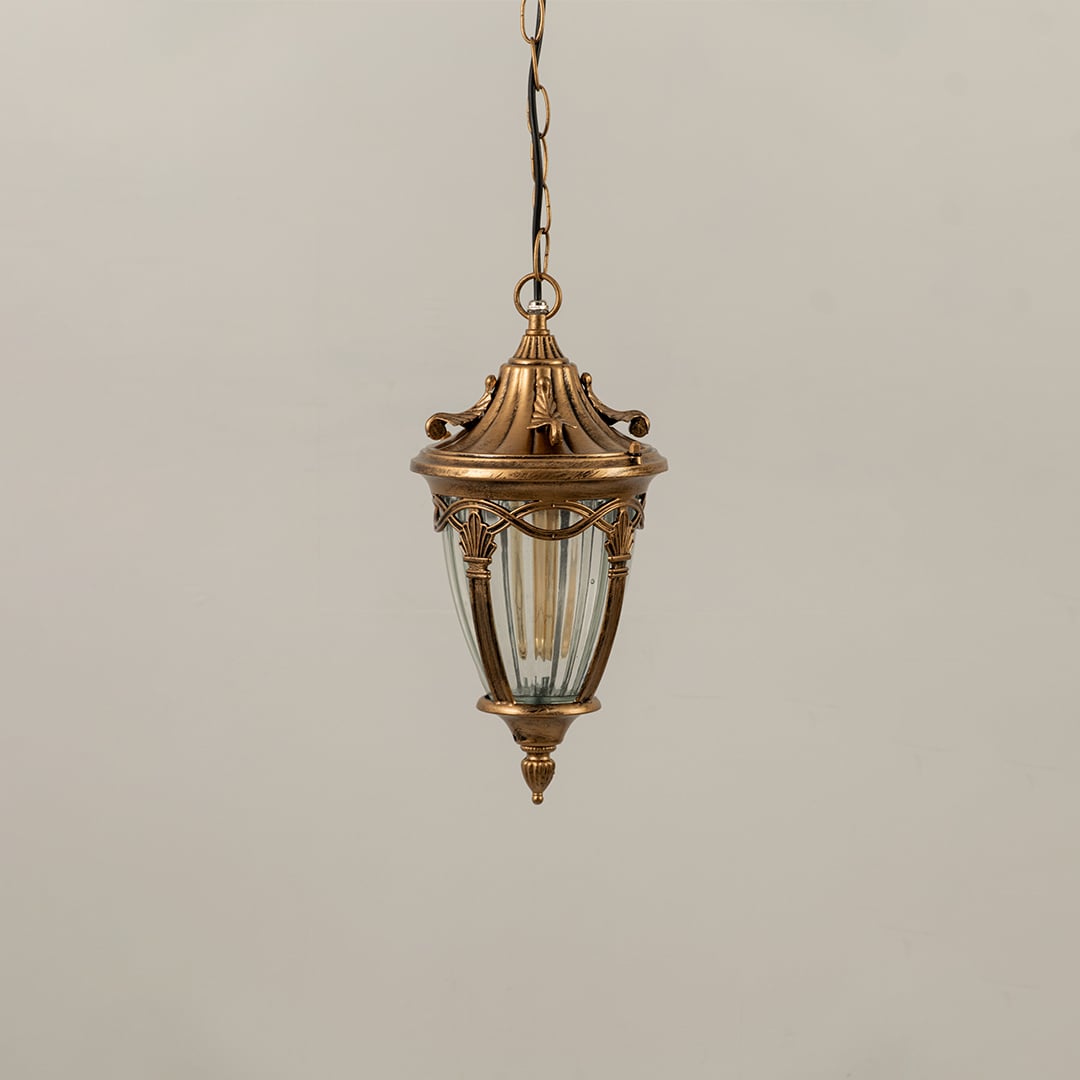Antique gold metal hanging lantern with ribbed glass shade displayed with lights off for elegant outdoor home decor.