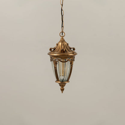Antique gold metal hanging lantern with ribbed glass shade displayed with lights off for elegant outdoor home decor.