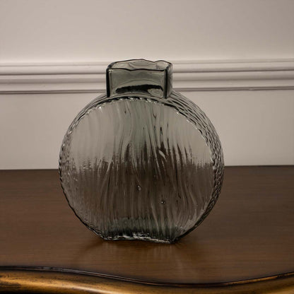 Textured round smoke grey glass vase for artistic shelf decor and modern interior design accents in your home.