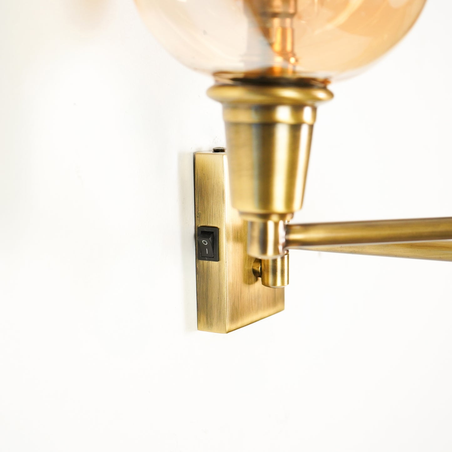 Closeup image of classy swivel two arm antique bedside wall light for elegant bedroom decor styling and modern lighting.