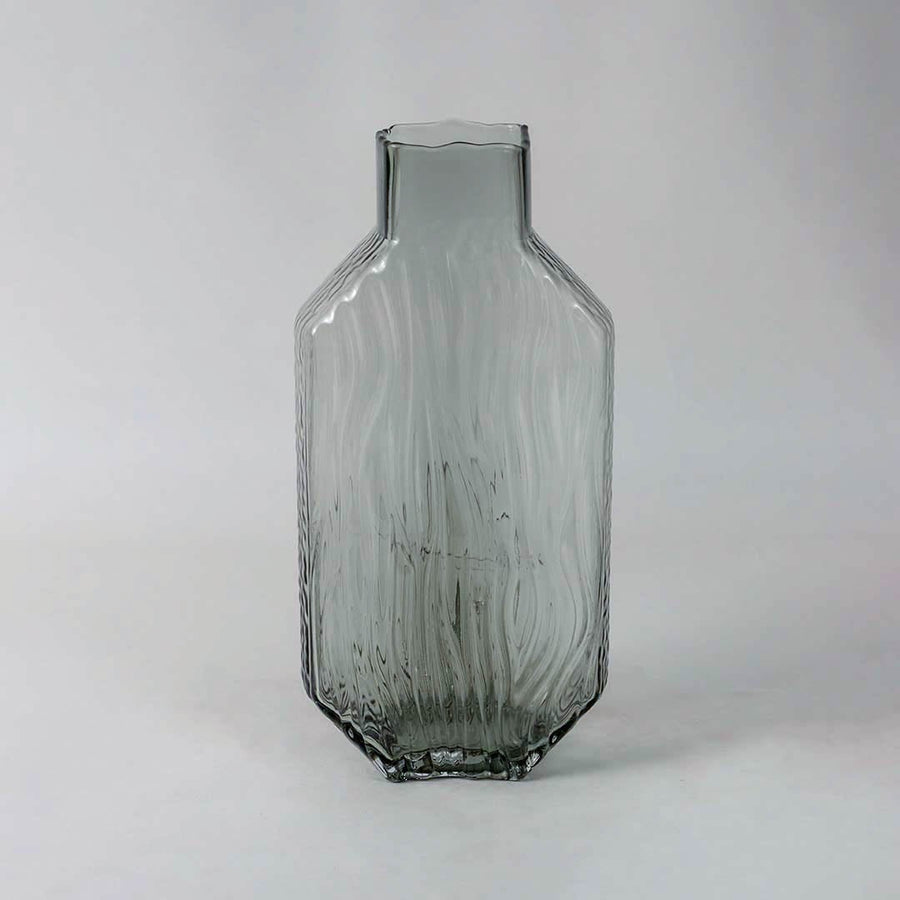Textured smoky gray decorative glass vase with a contemporary design shown clearly on white backdrop for product detail.