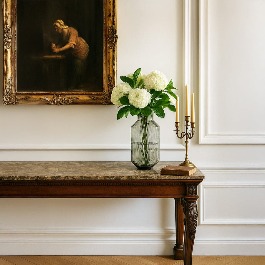 Tall smoky gray textured glass vase styled in a modern living space adding elegance and a minimalist decorative touch.