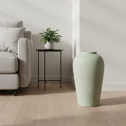 Pastel green floor vase in modern living room for clean minimalist home interior design and serene aesthetic appeal.