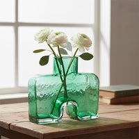 Green art glass vase styled on living room table modern decorative glass accent for console shelf or center table styling home.