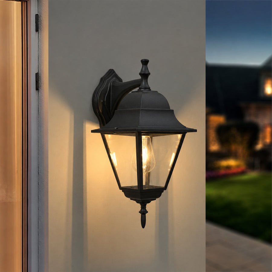 Black metal outdoor lantern wall light lifestyle image with warm lighting for stylish exterior wall decor.