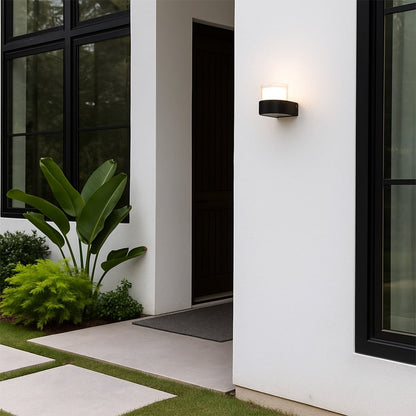 Contemporary wall light adding a subtle glow to minimalist interiors featuring a compact cylindrical design for modern homes.