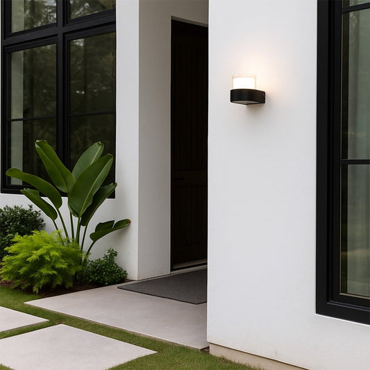 Contemporary wall light adding a subtle glow to minimalist interiors featuring a compact cylindrical design for modern homes.