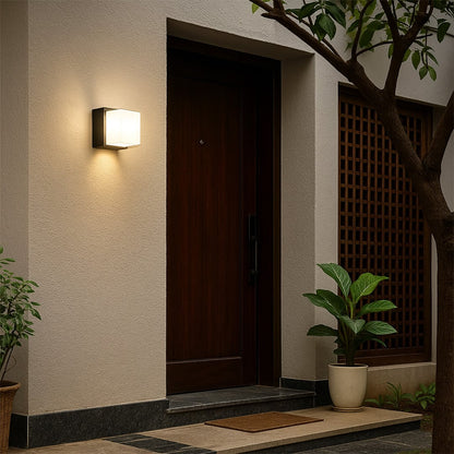 Vintage black outdoor wall light lifestyle image with ornate detailing for elegant exterior entryway decor.