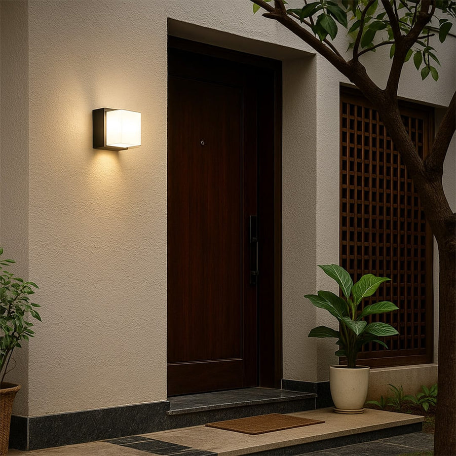 Vintage black outdoor wall light lifestyle image with ornate detailing for elegant exterior entryway decor.