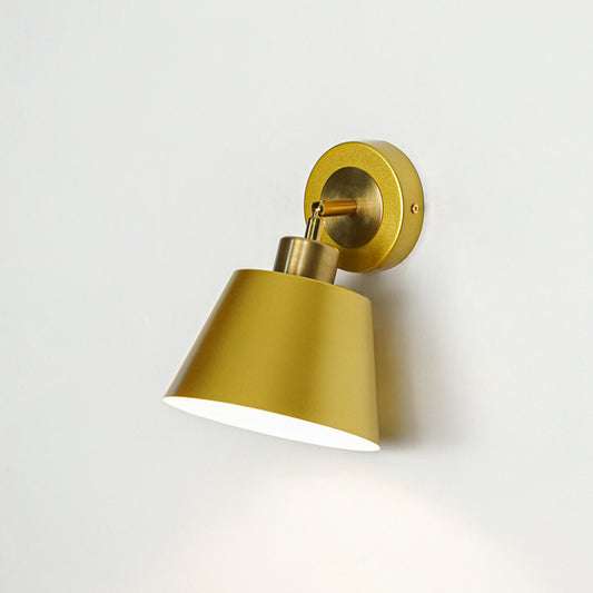 Gold finish wall light with cone shade perfect for modern bedroom or hallway wall decor placement on clean background.