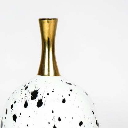 Closeup image of white ceramic speckled vase with gold neck for luxury tabletop decor styling and artistic finish.