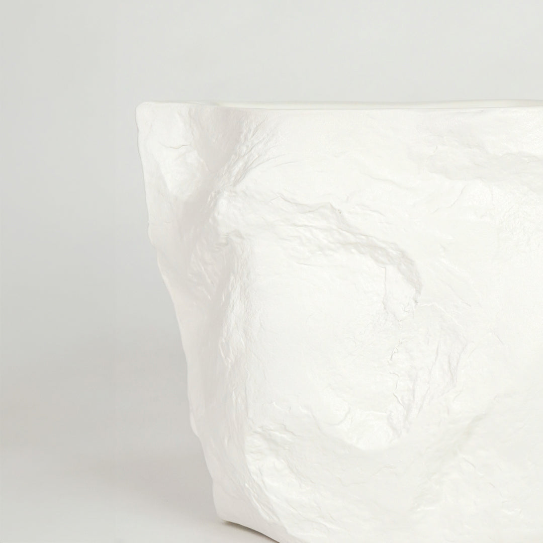 Closeup image of white marble finish abstract decor vase for modern console table styling with elegant texture detail.