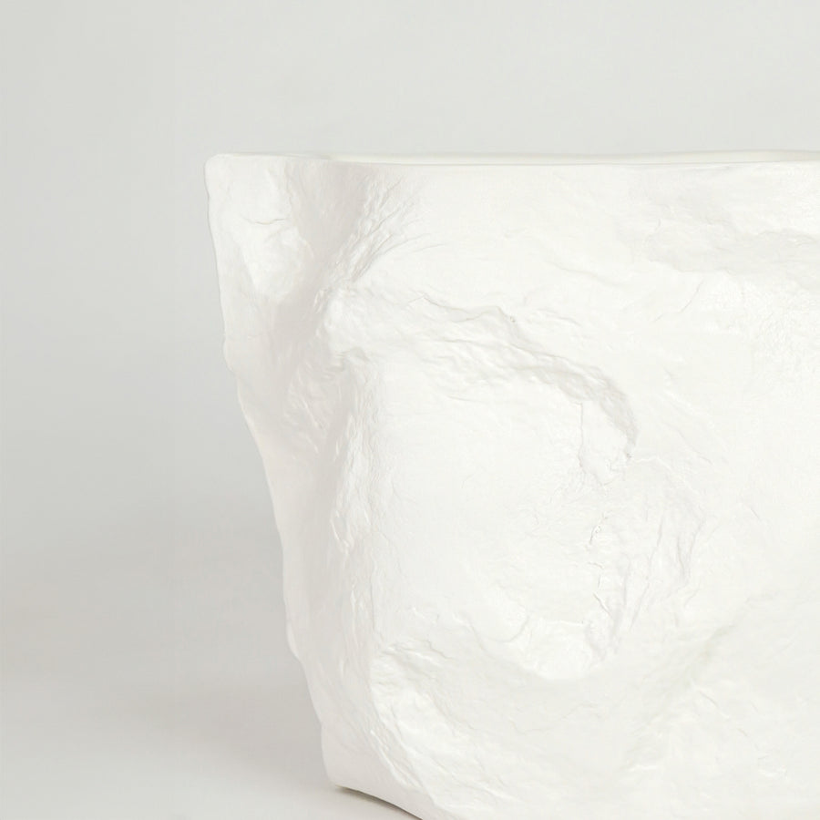 Closeup image of white marble finish abstract decor vase for modern console table styling with elegant texture detail.