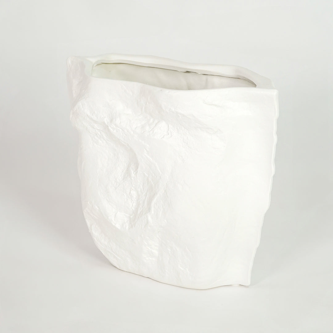 White ceramic planter pot for modern living room shelf placement and minimalist indoor decor styling display accent piece.