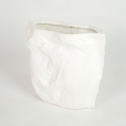 White ceramic planter pot for modern living room shelf placement and minimalist indoor decor styling display accent piece.