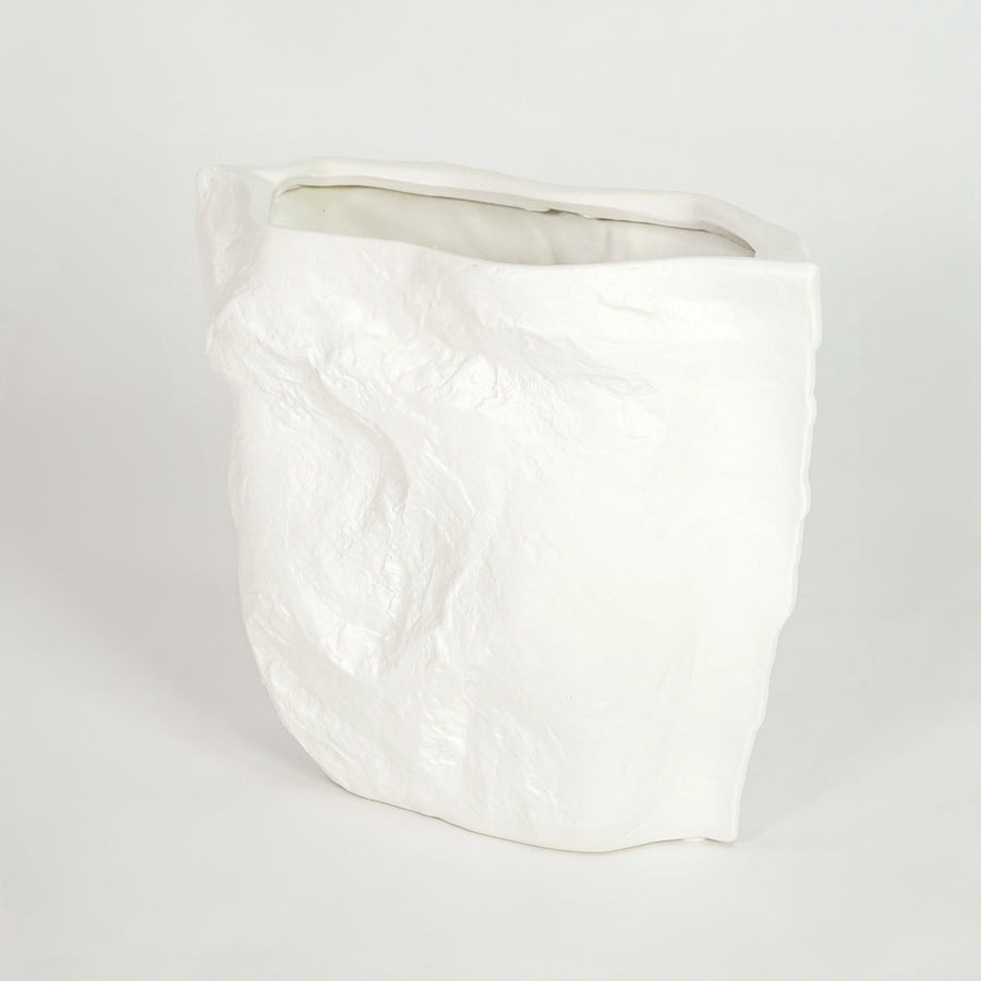 White ceramic planter pot for modern living room shelf placement and minimalist indoor decor styling display accent piece.