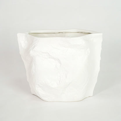 White textured ceramic planter pot for minimalist bedroom shelf placement and modern indoor decor styling display art.