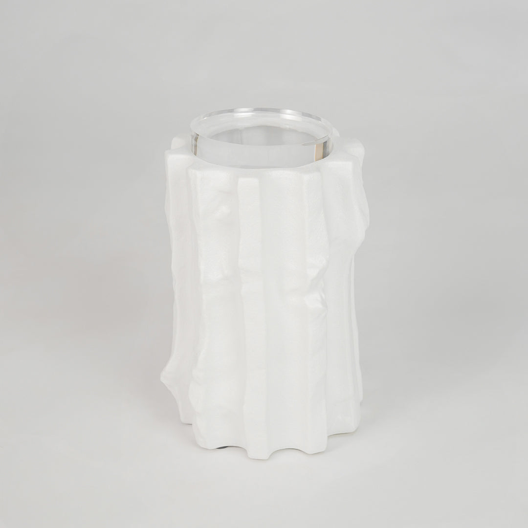 White sculptural ceramic candle holder for stylish shelf placement and contemporary indoor home decor styling accent.