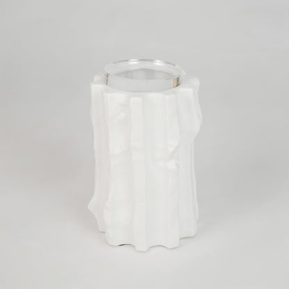 White sculptural ceramic candle holder for stylish shelf placement and contemporary indoor home decor styling accent.