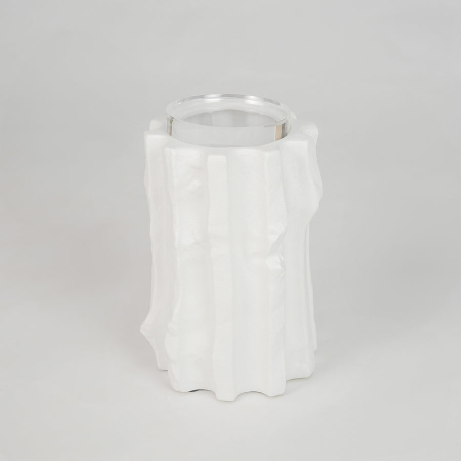 White sculptural ceramic candle holder for stylish shelf placement and contemporary indoor home decor styling accent.