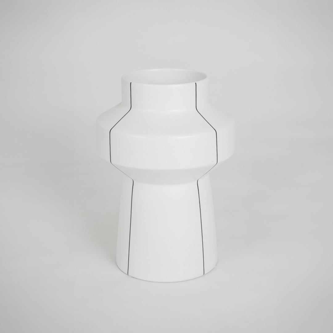 White modern ceramic vase for elegant coffee table placement and contemporary indoor decor styling accent piece.