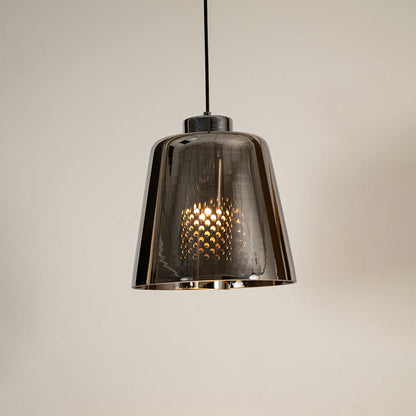 Smoked grey glass pendant light glowing warmly on white background showcasing its modern reflective shade for stylish interior lighting.