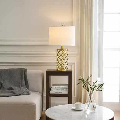 White shade geometric lamp on side table with light off and bright window background for clean modern décor.
