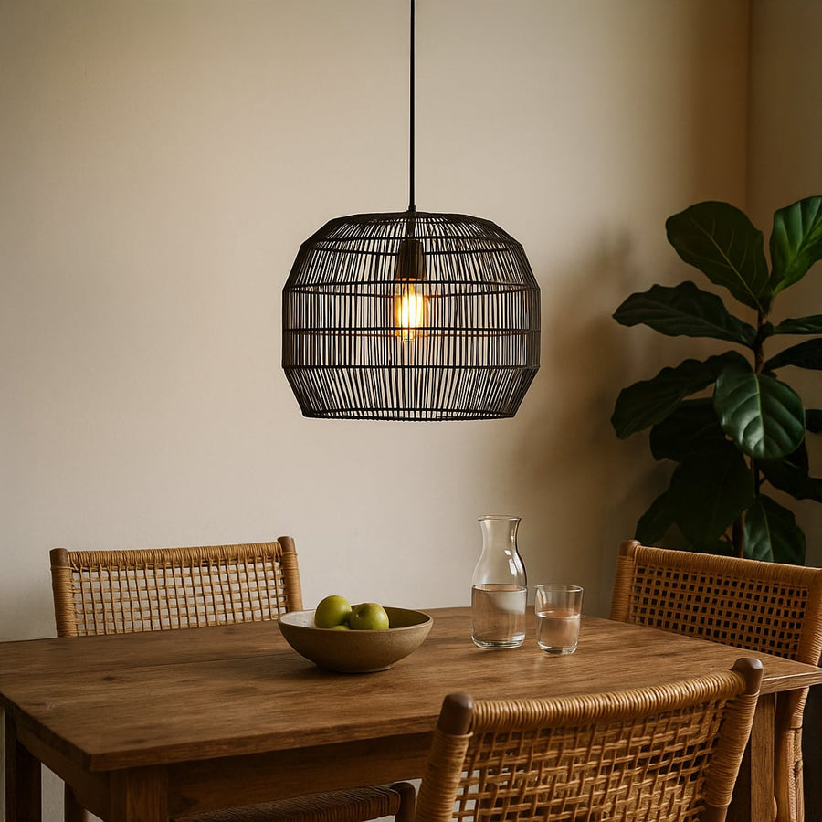 Modern black rattan pendant light adding a sleek decorative touch to contemporary interiors with warm ambient lighting.