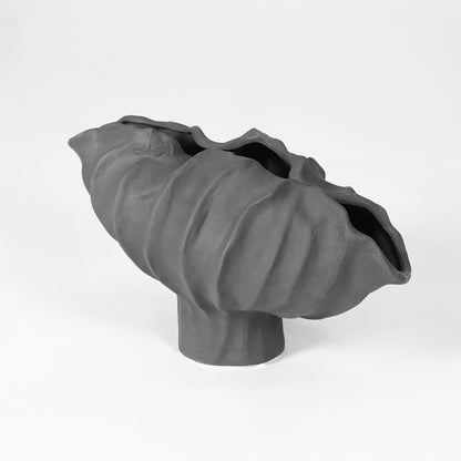 Black sculptural ceramic bowl for modern coffee table placement and elegant indoor home decor styling accent.