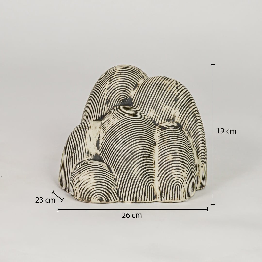 Beige textured ceramic decor sculpture size 19 cm height 26 cm width 23 cm depth decorative showpiece for table styling.