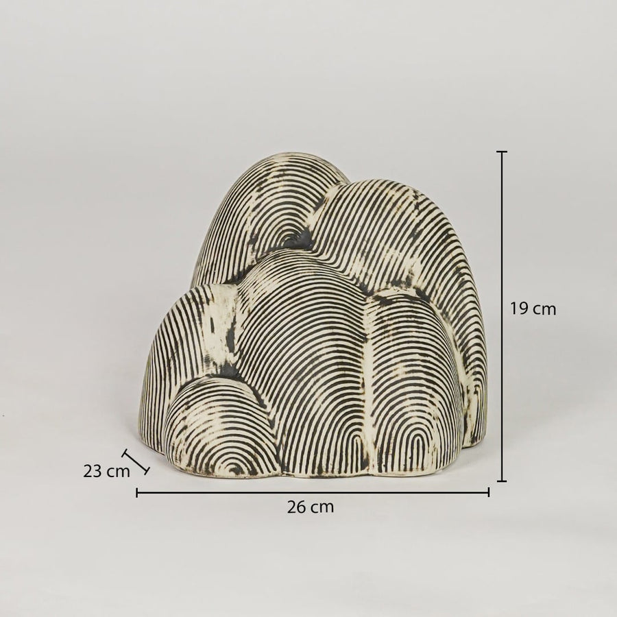 Beige textured ceramic decor sculpture size 19 cm height 26 cm width 23 cm depth decorative showpiece for table styling.