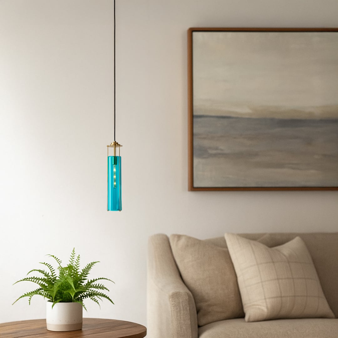 Stylish blue glass pendant light with brass accents adding a modern touch to interior decor creating a vibrant and elegant lifestyle look.