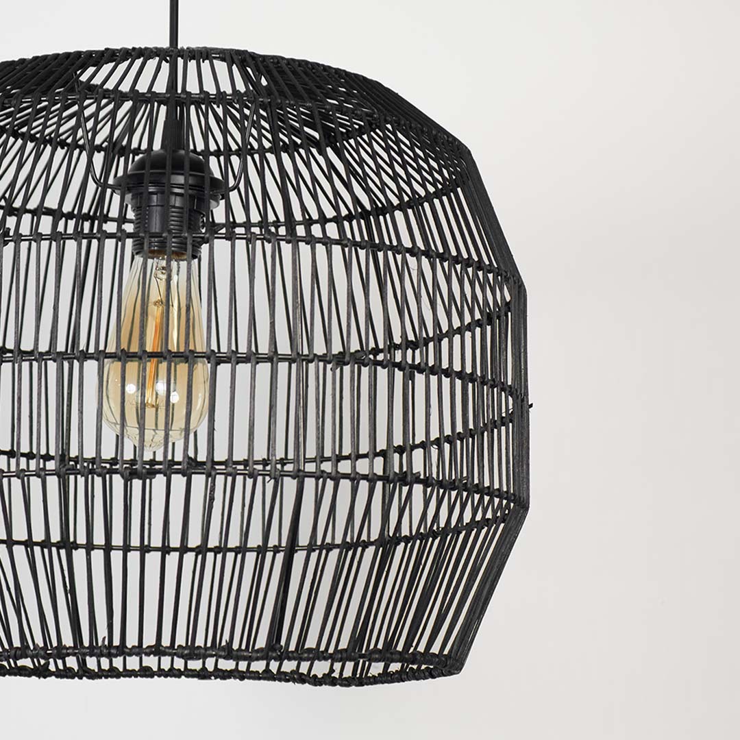 Closeup view of black rattan pendant light revealing detailed weaving and premium hand-finished craftsmanship for modern decor.