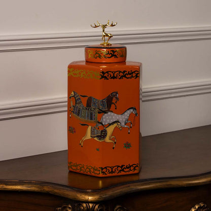 Square orange ceramic jar featuring hand-painted horse motifs with intricate gold detailing and a glossy finish.